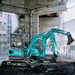 Sunward SWE25UF zero-tail mini excavator working close to a wall